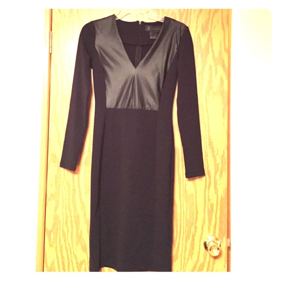 Black form fitting dress with faux leather detail