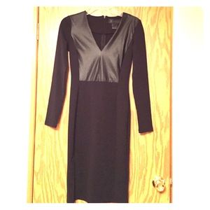 Black form fitting dress with faux leather detail