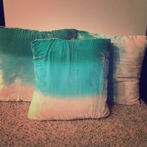 Three teal ombré pillows