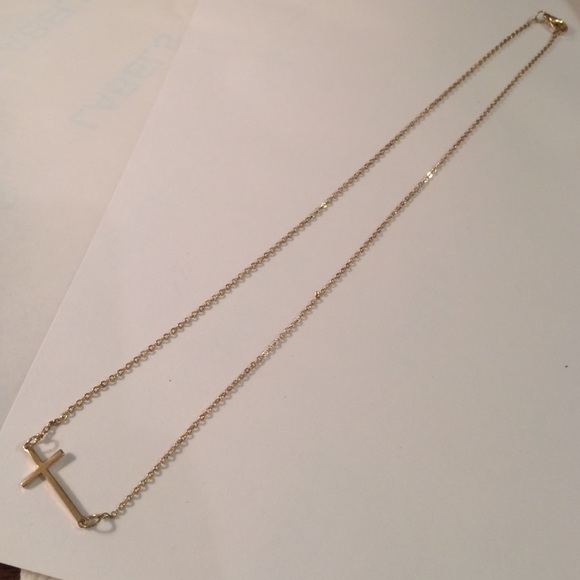 Gold toned cross necklace. NWOT
