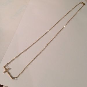 Gold toned cross necklace. NWOT