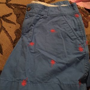 Old navy blue shorts with orange palm trees