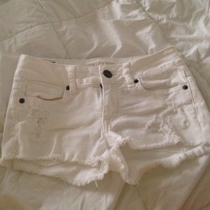 White distressed cutoff shorts. American Eagle