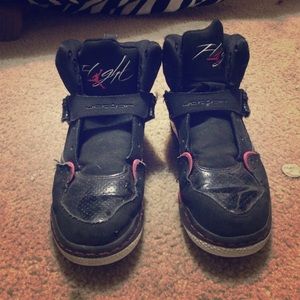 Black and hot pink Jordan flights