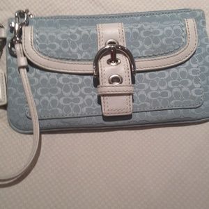 Light blue cloth coach clutch