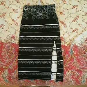 Hand knit skirt with a slit.