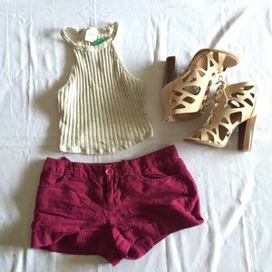 Burgundy shorts.