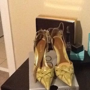 Olive/tan genuine leather pumps with ankle strap.