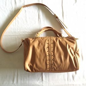Tan studded purse.