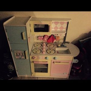 Little girls play kitchen