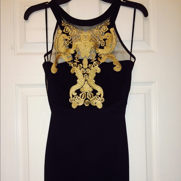 Short black and gold  *above knee* dress.