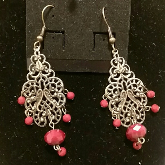 Copper dangling earring with dark red stones