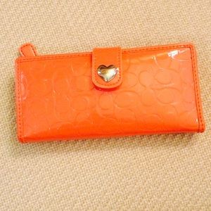 coach wallets peach