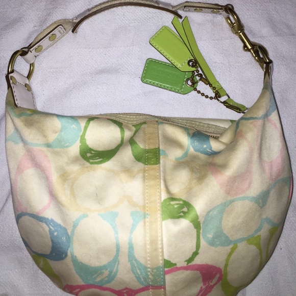 White multicolored Coach purse.