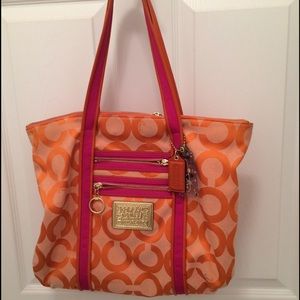 Pink gold and orange coach large carry on bag