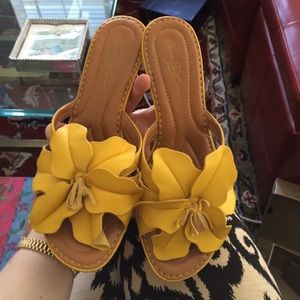 Yellow heels with large flower