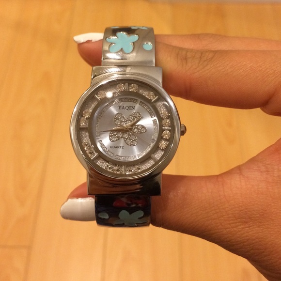 Silver jeweled watch with blue flowers