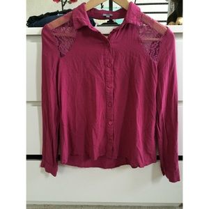 a maroon long sleeve shirt