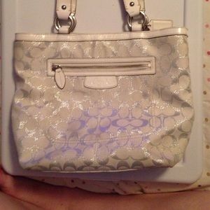 White coach bag with silver C's