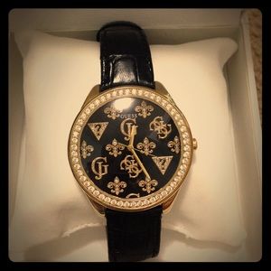 GUESS? Black and gold watch
