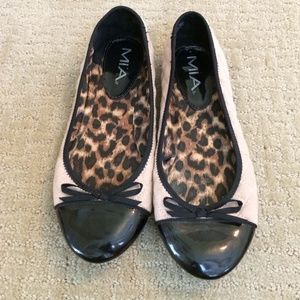 Nude and black ballet flats