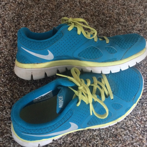 Blue and yellow Nike tennis shoes