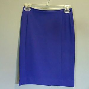 Edgy pencil skirt with exposed gold zipper detail