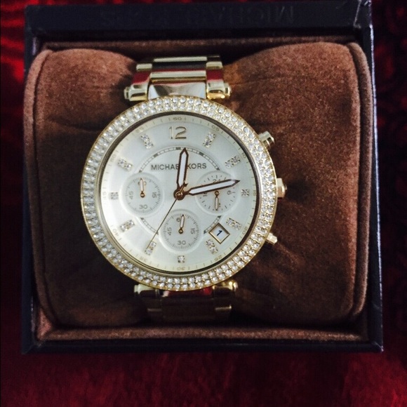 Beautiful MK watch with gold outer trim.