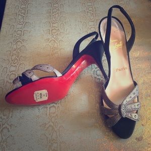 Classic Louboutin silver d'Orsay sandals.
