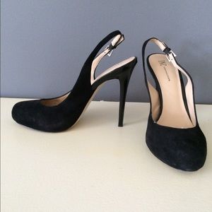 Black suede slingback pumps