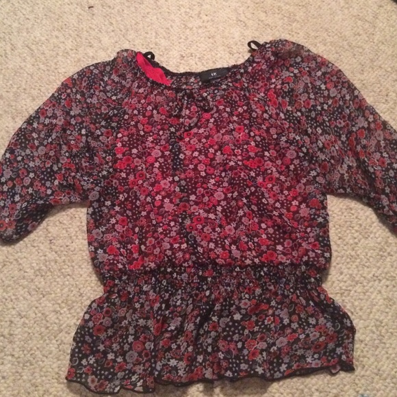 a black, red, and white floral shirt