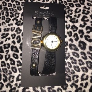 Black and gold tone love watch.