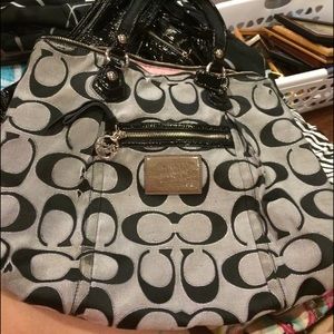 large worn coach handbag