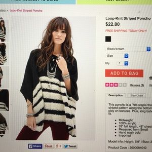 Black sweater poncho with white stripes