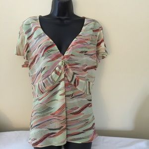 Green top with multicolored stripes.