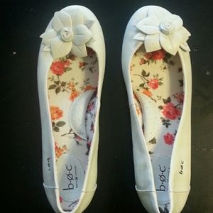 Born Concept white flats with flower petal on toes