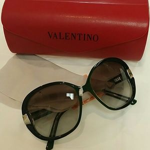 Valentino sunglasses in very dark green.