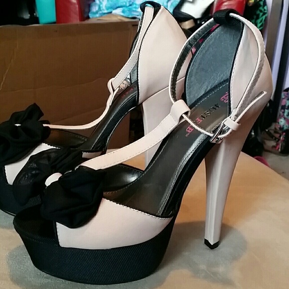 JustFab Shoes - Blush color heels with black bow.