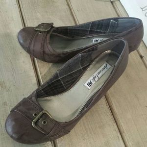 Wedge brown swede look with buckle over toe.