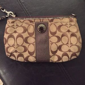 Authentic Brown and Natural Coach Wristlet. $15