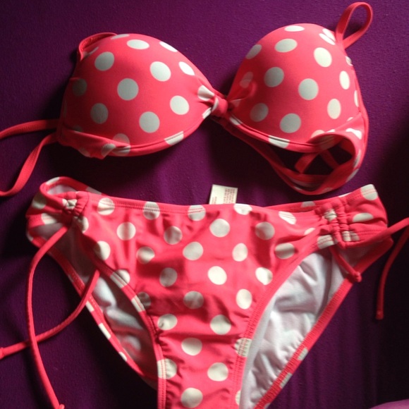 Bright pink and white polka dot swim suit.