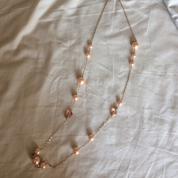 Yellow gold with rose colored pearls and crystals.