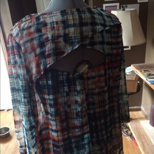 Sheer plaid top with cutout on the back!