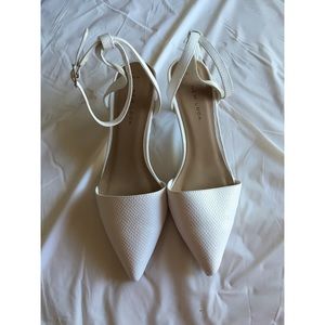 White pointy heels