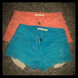 Teal and Coral shorts w/ pocket fabric showing