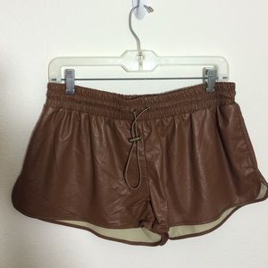 BROWN FAUX LEATHER TRACK SHORTS