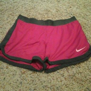 Pink nike shorts.