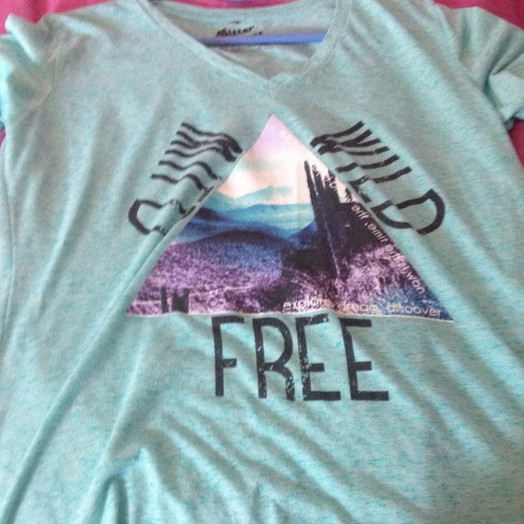 Teal t shirt with graphics on the front