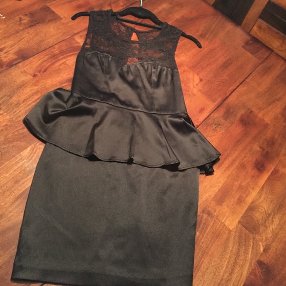Black peplum dress with lace detail on top