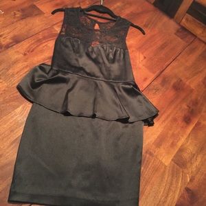 Black peplum dress with lace detail on top